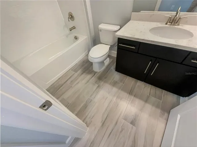 a bathroom with a sink and a toilet