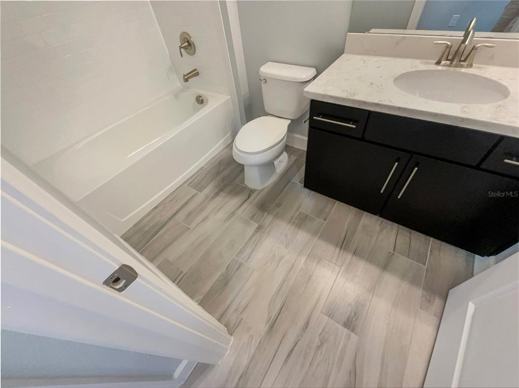 705 Winterside Drive Apollo Beach, FL 33572 - Photo 22 of 30 a bathroom with a sink and a toilet