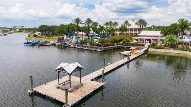 a view of a lake with a table and chairs