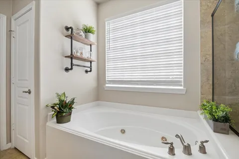 a white bath tub with a shower