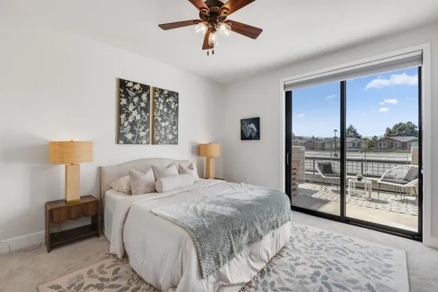 a bedroom with a large bed and a window