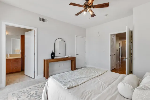 a bedroom with a bed and a dresser