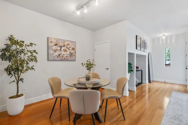a dining room with furniture and window