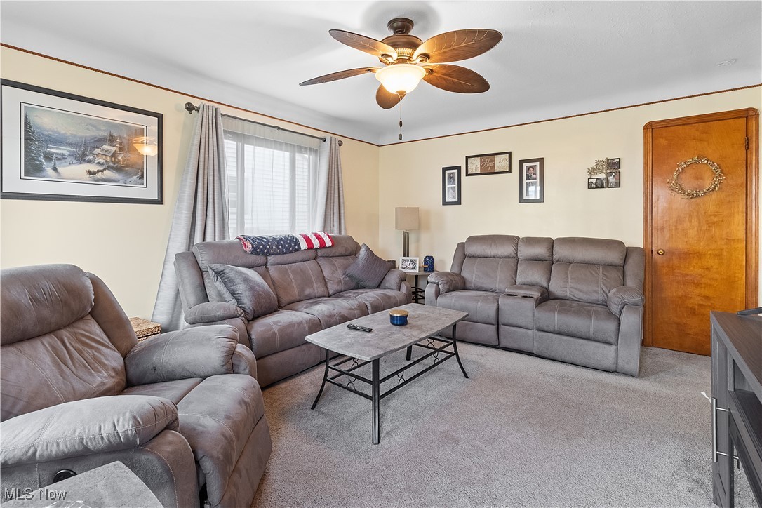 5225 Roseside Avenue Parma, OH 44134 - Photo 8 of 22 Carpeted living area featuring ceiling fan