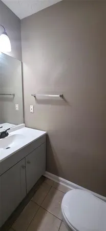 a bathroom with a sink a toilet and vanity