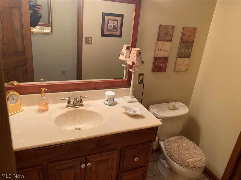303 Orchard View Road Northeast Lancaster, OH 43130 - Photo 38 of 50 Bathroom featuring toilet, oversized vanity, and tile flooring