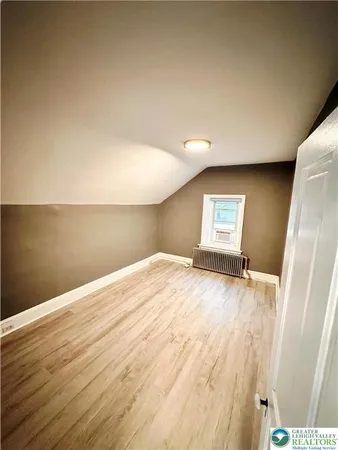 a view of staircase with wooden floor