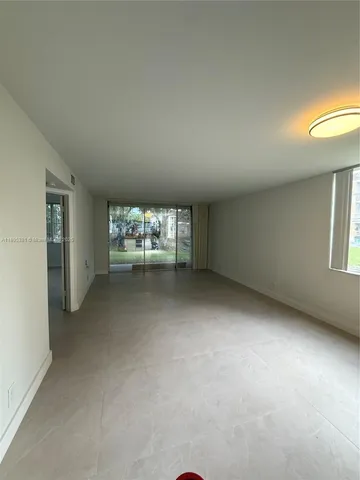 an empty room with a fireplace