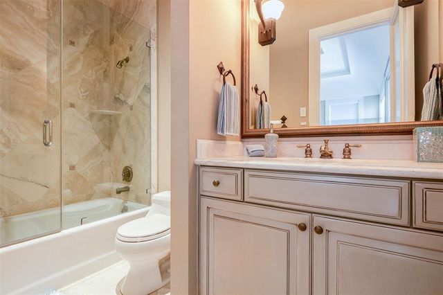 a view of a swimming pool and lounge chairs