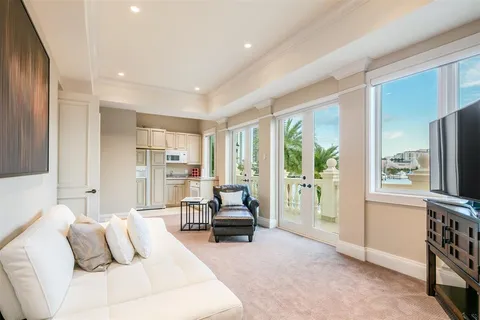 a view of a swimming pool with an outdoor seating