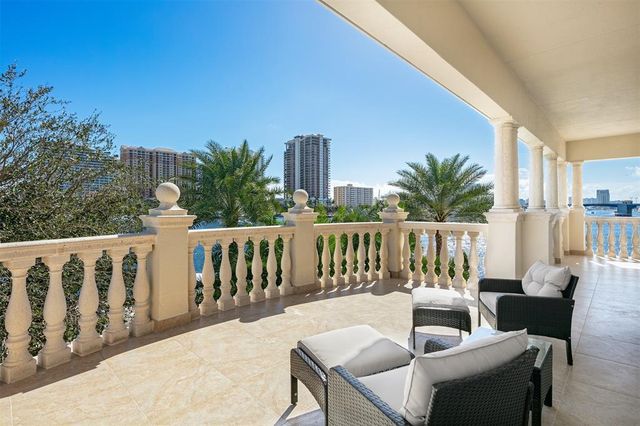 a view of a house with pool and chairs