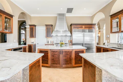 a view of staircase with white walls and a rug