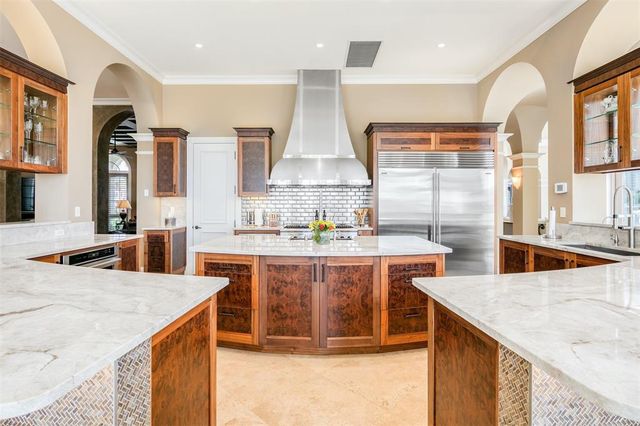 a view of staircase with white walls and a rug