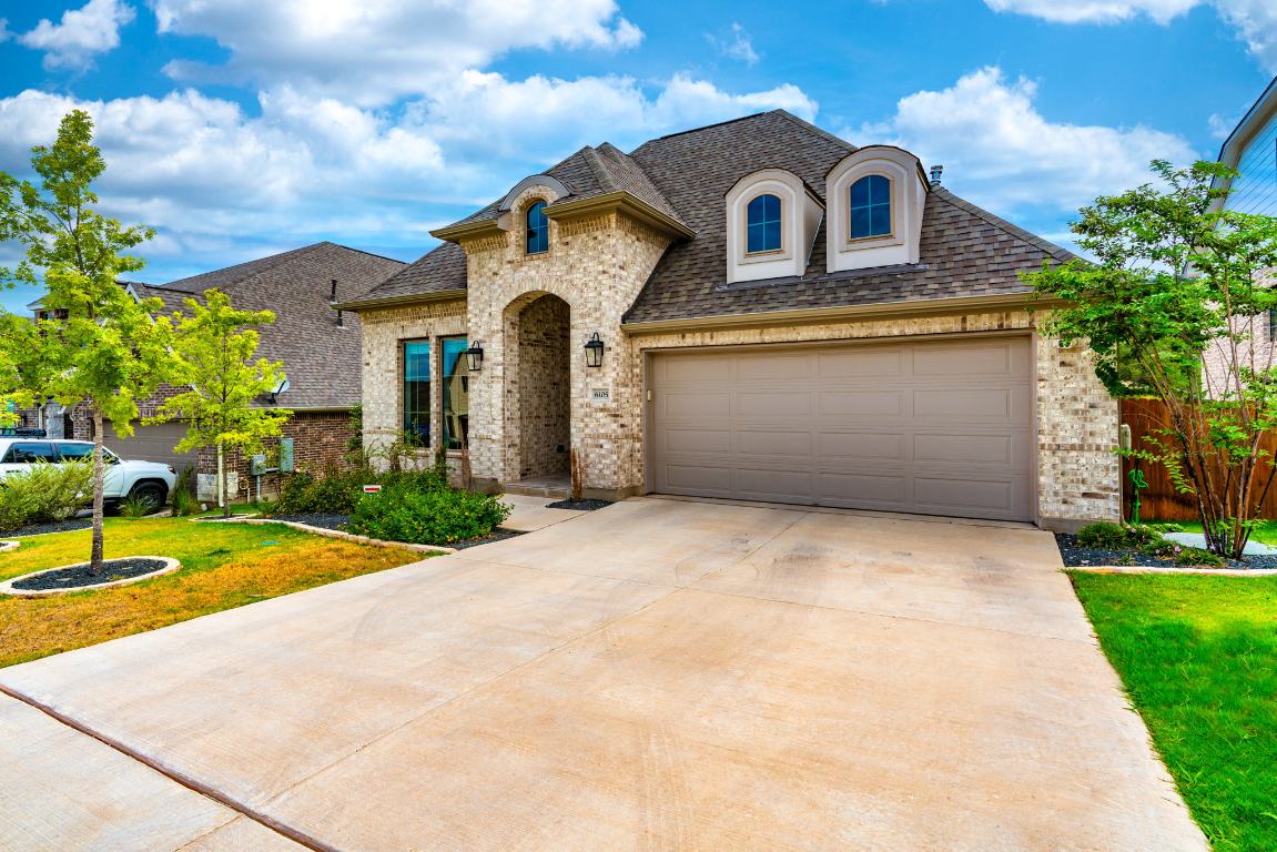 6105 Fadden Road Austin, TX 78738 - Photo 2 of 40 a front view of a house with garden