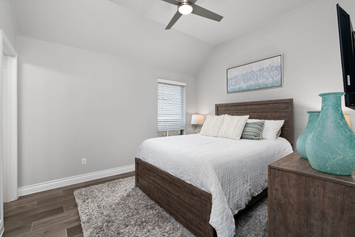 6105 Fadden Road Austin, TX 78738 - Photo 24 of 40 a bed sitting in a bedroom next to a window