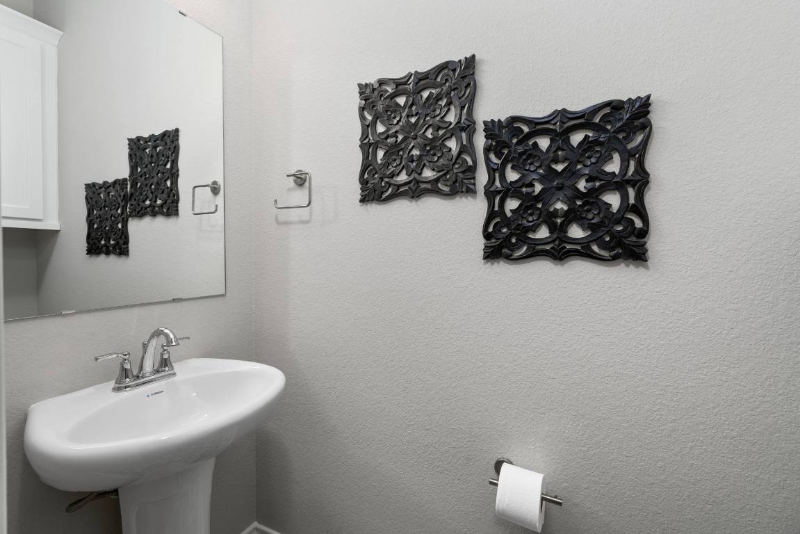 6105 Fadden Road Austin, TX 78738 - Photo 29 of 40 a bathroom with a sink and mirror