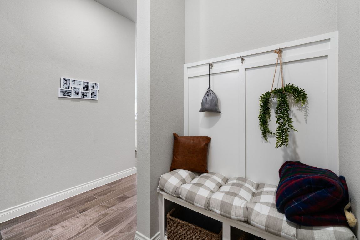 6105 Fadden Road Austin, TX 78738 - Photo 31 of 40 a bedroom with a bed and a potted plant