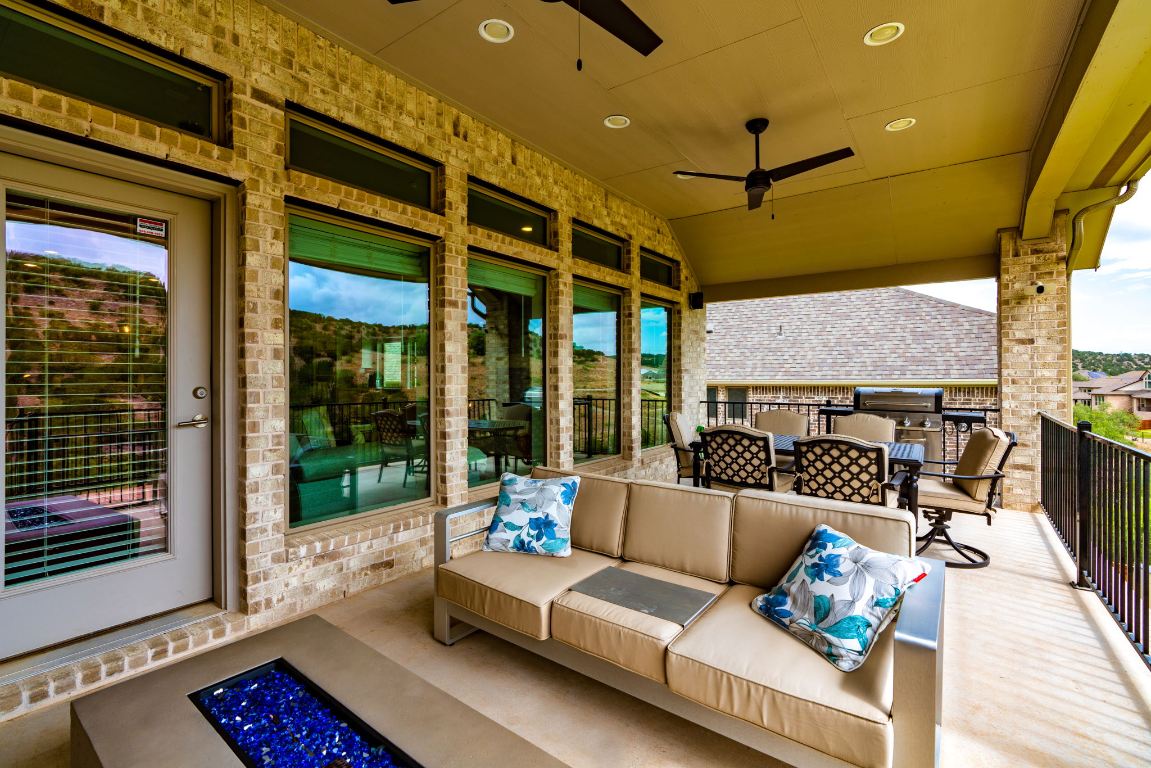 6105 Fadden Road Austin, TX 78738 - Photo 32 of 40 a outdoor living space with furniture and a fireplace