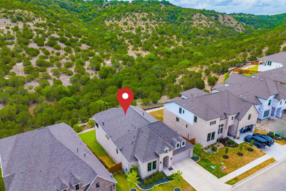 6105 Fadden Road Austin, TX 78738 - Photo 37 of 40 an aerial view of a house with a garden and swimming pool