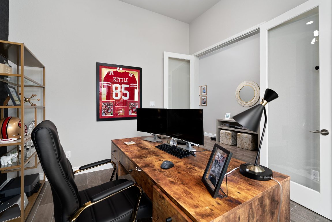 6105 Fadden Road Austin, TX 78738 - Photo 5 of 40 a workspace with furniture and musical instruments