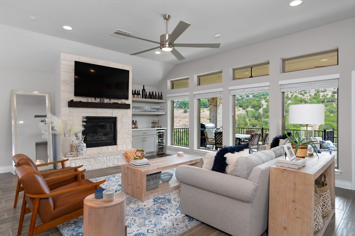 6105 Fadden Road Austin, TX 78738 - Photo 6 of 40 a living room with fireplace furniture and a flat screen tv