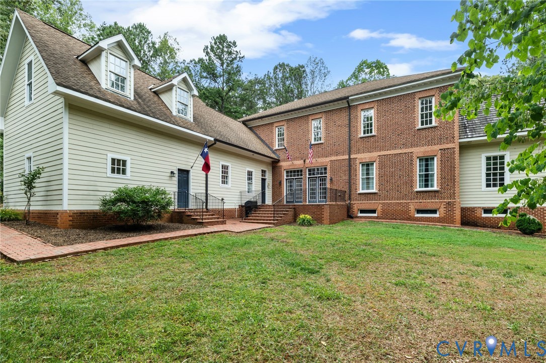 13173 Scotchtown Road Beaverdam, VA 23015 - Photo 60 of 65 a view of a house with a backyard and porch
