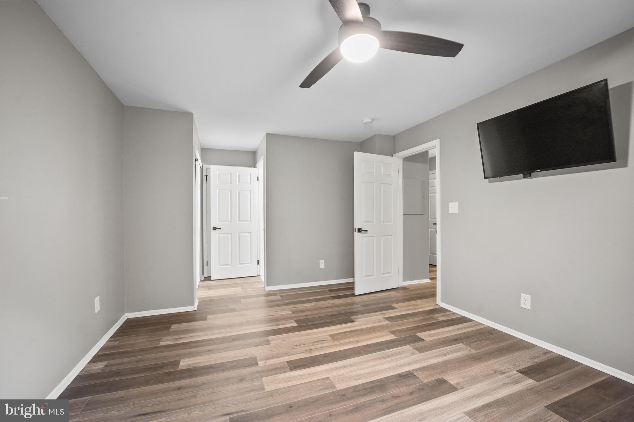 603 Quail Road Marlton, NJ 08053 - Photo 11 of 15 a view of a livingroom with an empty space and a flat screen tv