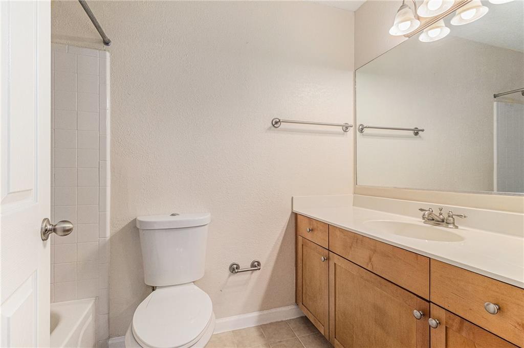 2657 Lenox Road Northeast, Unit C38 Atlanta, GA 30324 - Photo 13 of 20 a bathroom with a sink a toilet and shower
