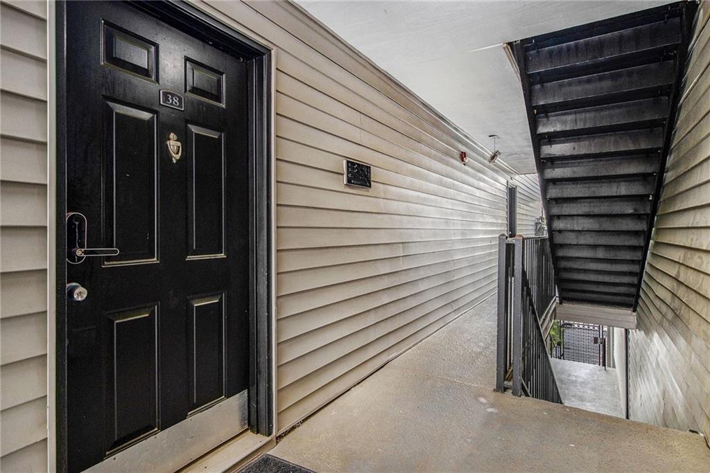 2657 Lenox Road Northeast, Unit C38 Atlanta, GA 30324 - Photo 4 of 20 a view of a house with a door and wooden bench