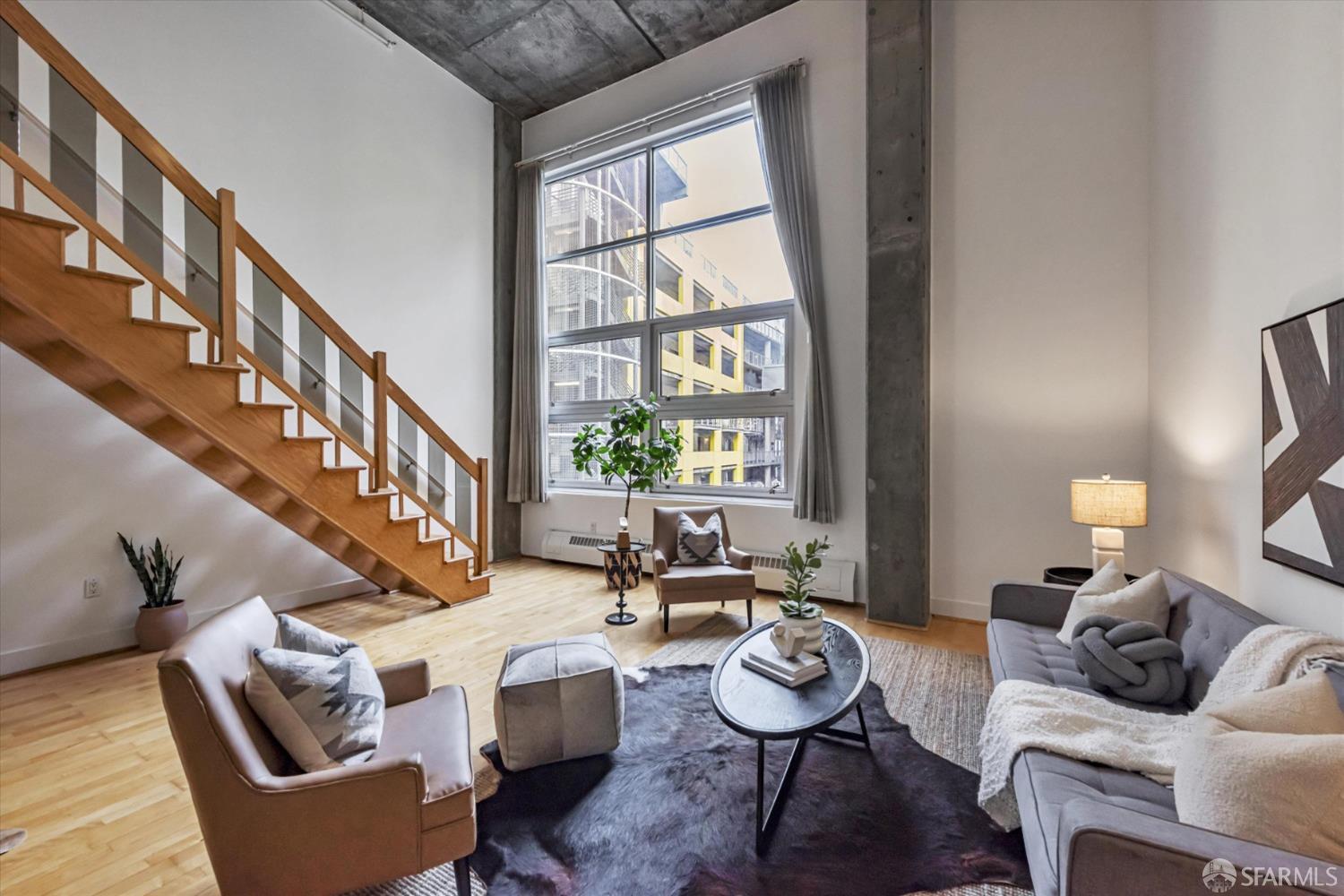 311 Oak Street, Unit 539 Oakland, CA 94607 - Photo 1 of 55 a living room with furniture and a large window