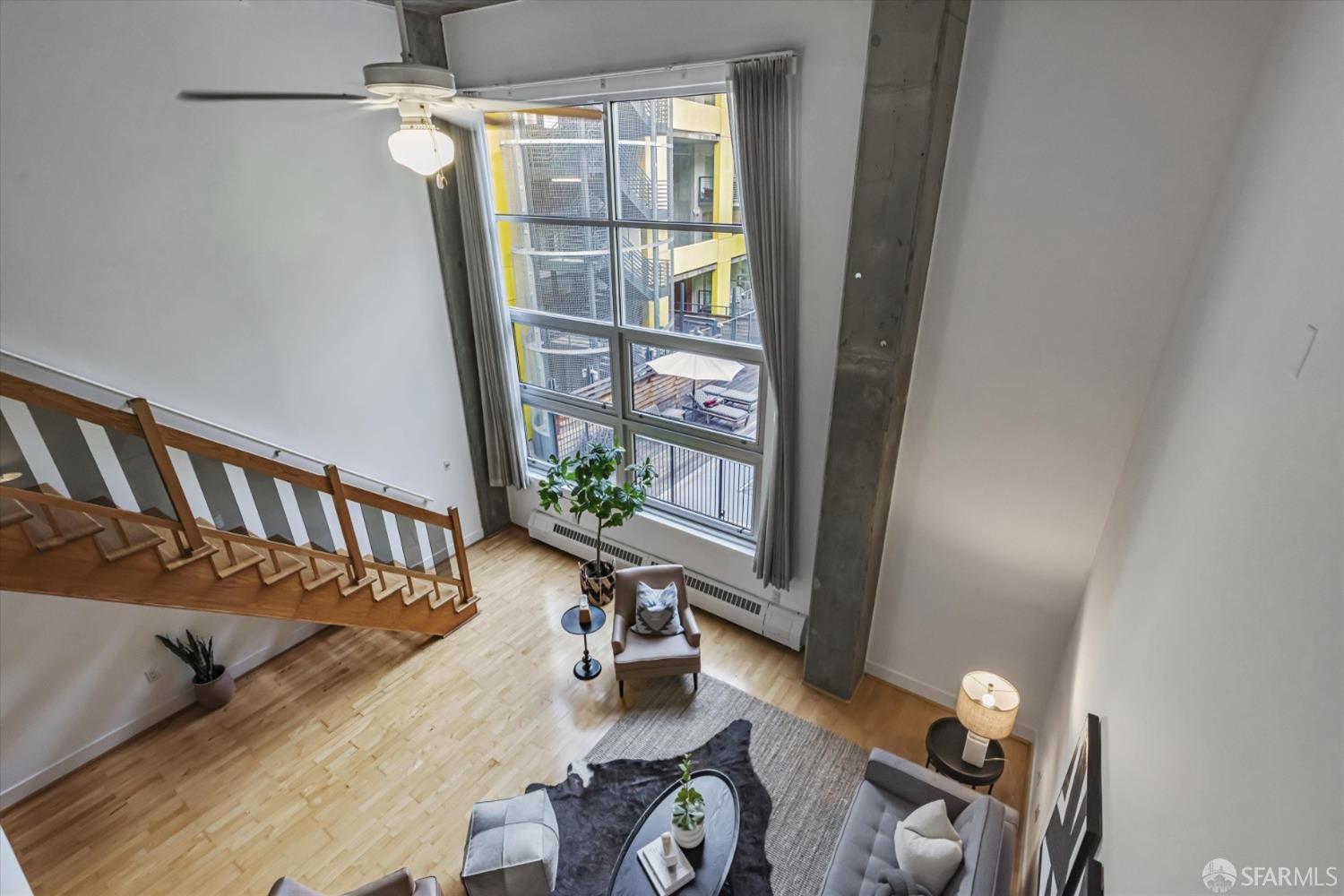 311 Oak Street, Unit 539 Oakland, CA 94607 - Photo 26 of 55 a bed room with furniture and a window