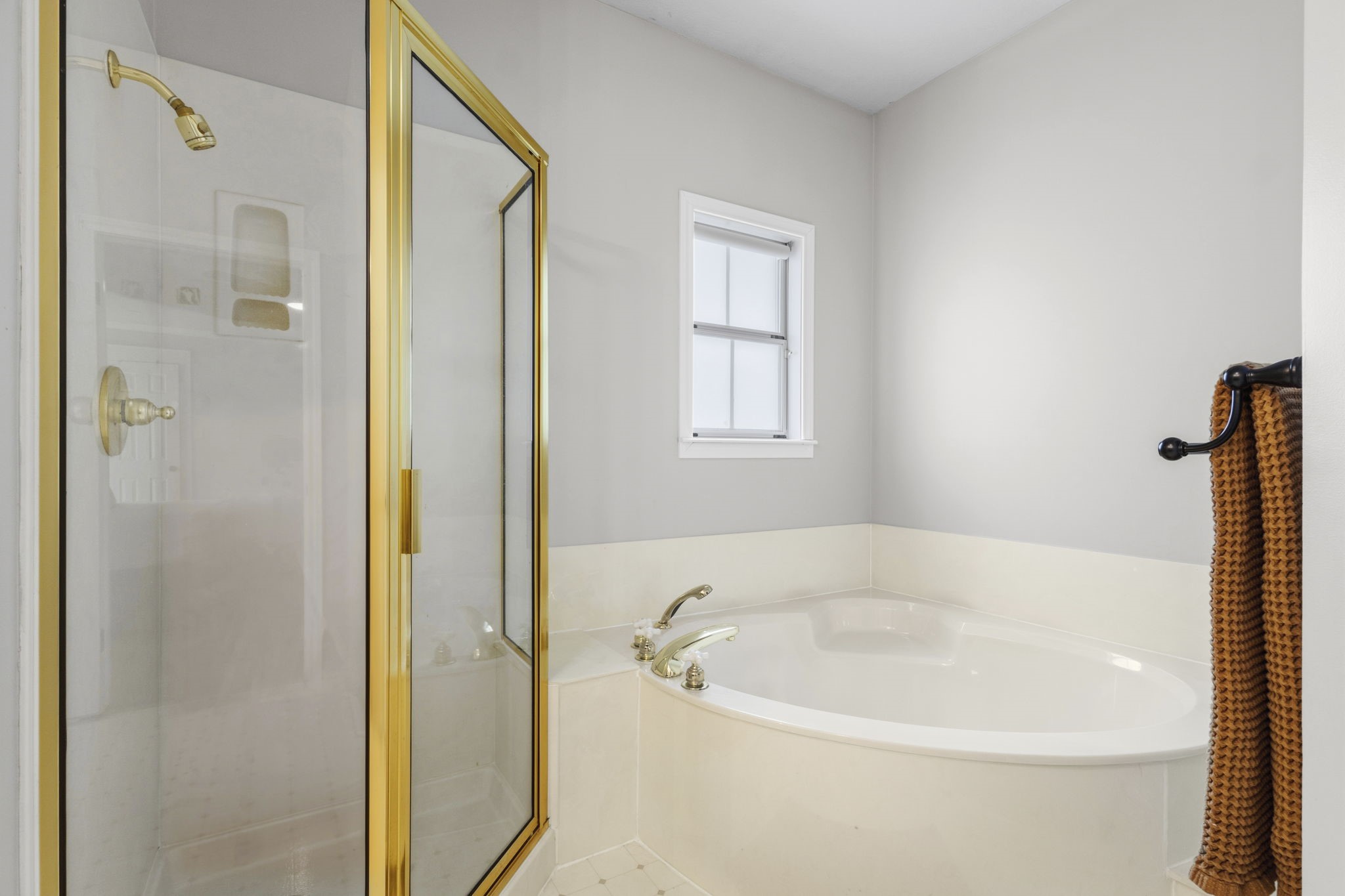 16421 Westbury Road Beaumont, TX 77713 - Photo 15 of 29 a white bath tub sitting next to a window