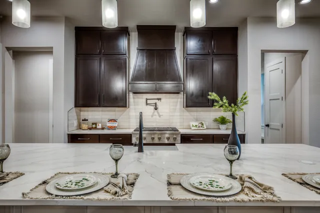 a kitchen with a sink and a refrigerator