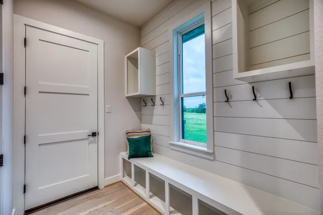 a view of entry way with wooden cabinet
