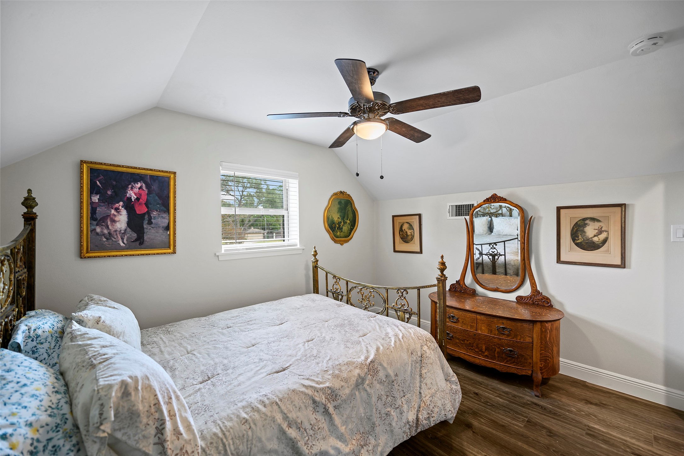 4419 Langtry Lane Houston, TX 77041 - Photo 11 of 50 a bedroom with a bed and a chandelier