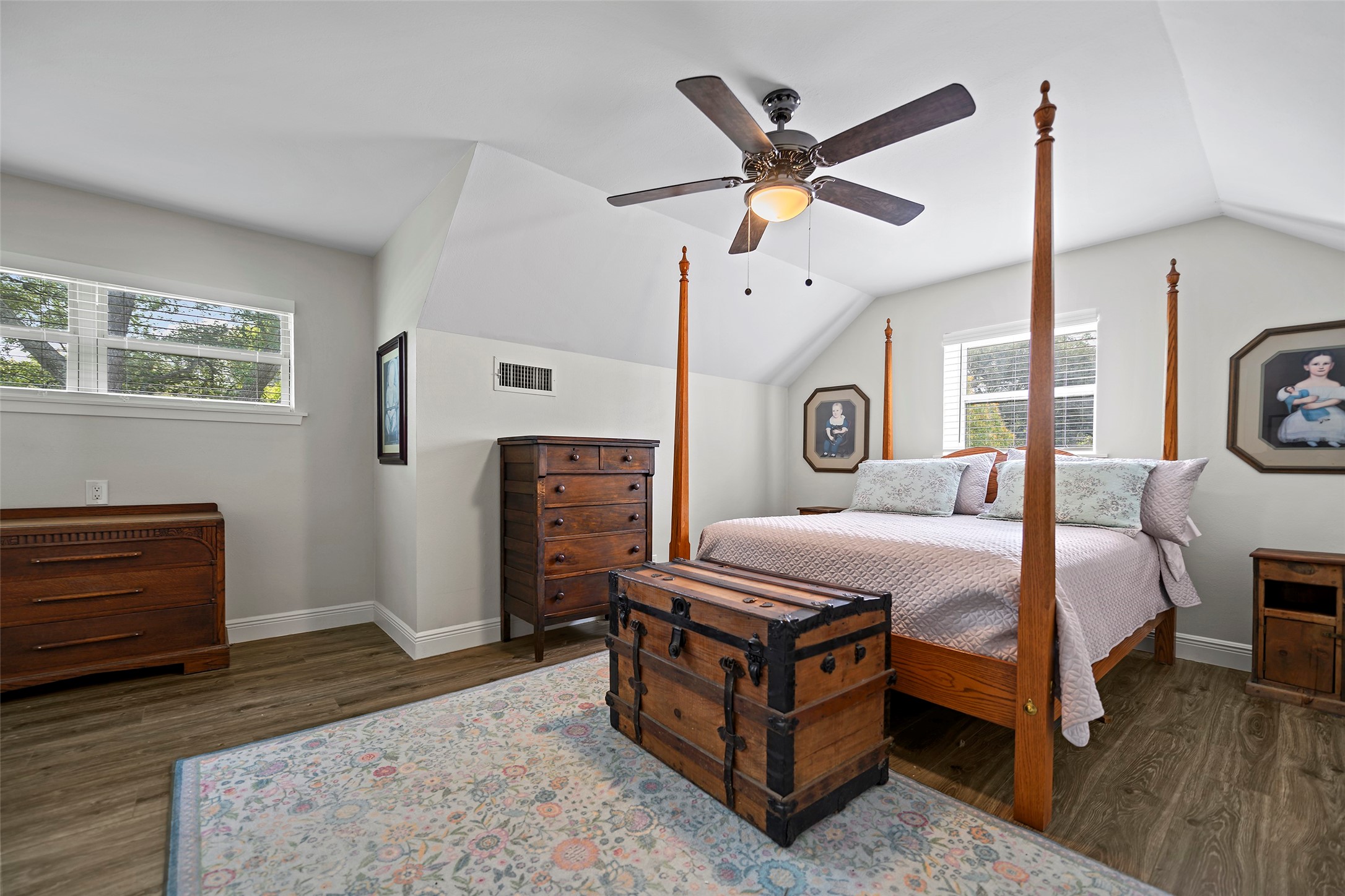 4419 Langtry Lane Houston, TX 77041 - Photo 18 of 50 a bedroom with a bed a window and a chandelier