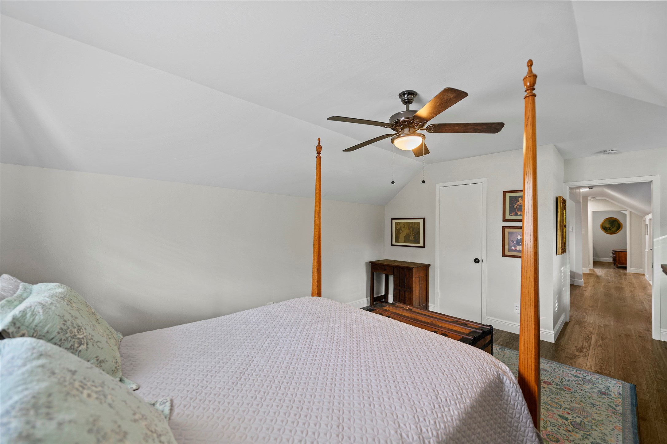 4419 Langtry Lane Houston, TX 77041 - Photo 19 of 50 a bedroom with a bed and a chandelier