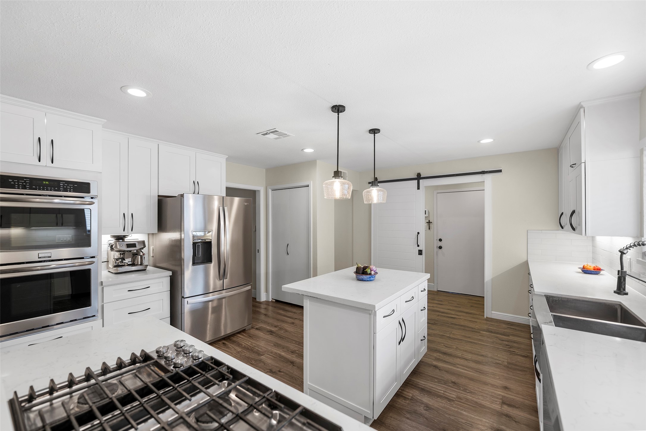 4419 Langtry Lane Houston, TX 77041 - Photo 28 of 50 a kitchen with a sink stove and refrigerator