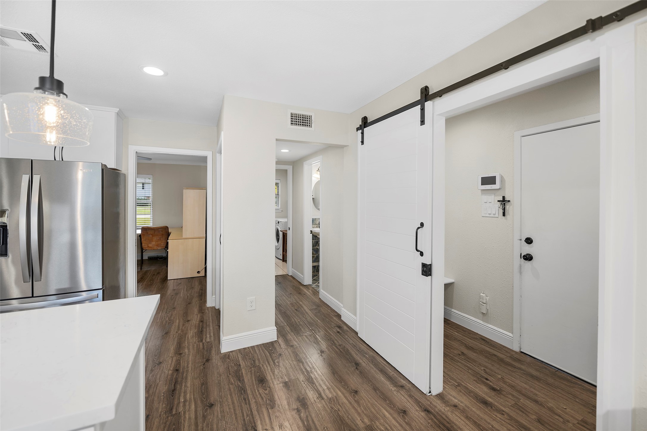 4419 Langtry Lane Houston, TX 77041 - Photo 29 of 50 a view of a hallway with wooden floor and staircase