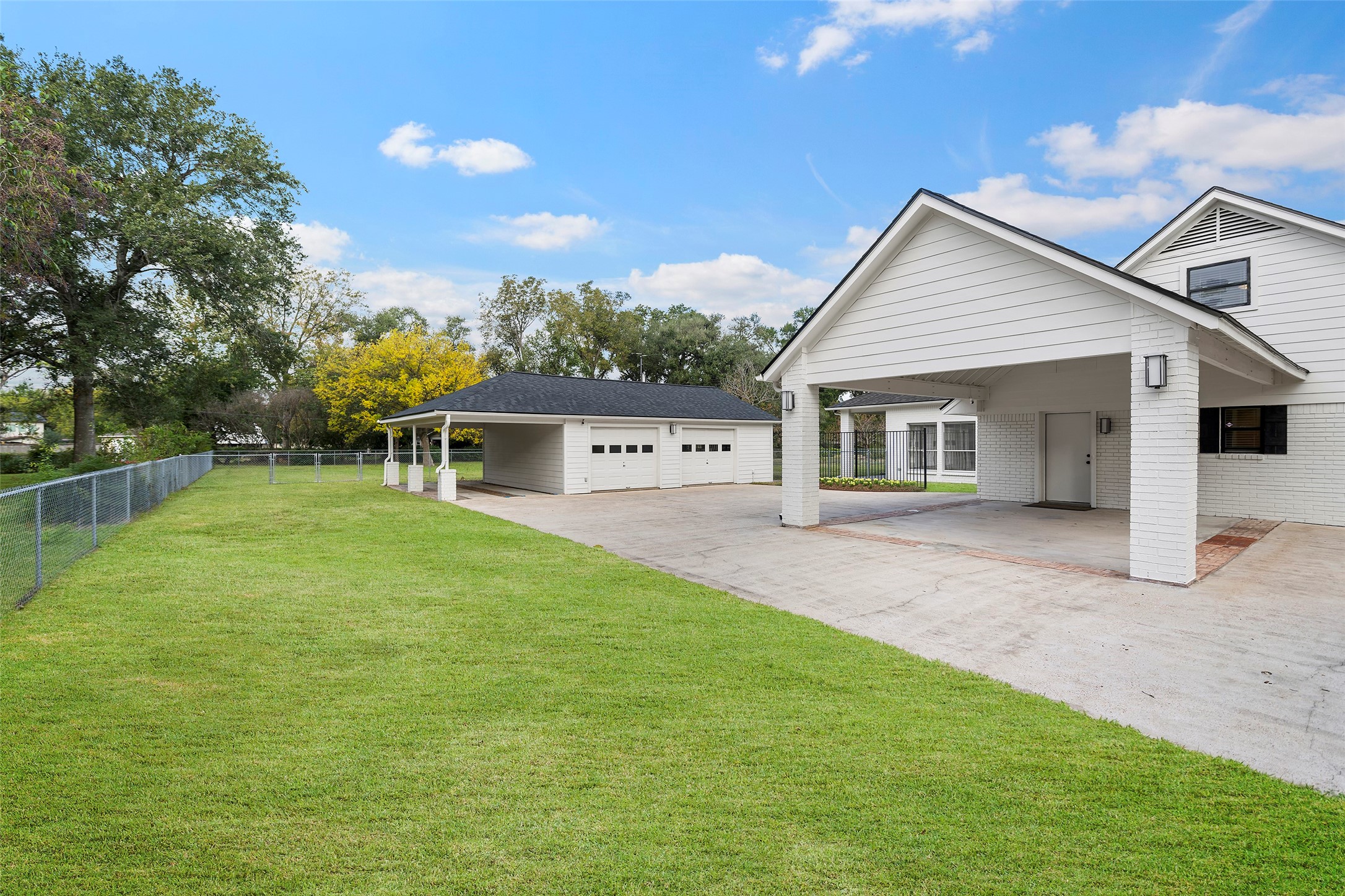 4419 Langtry Lane Houston, TX 77041 - Photo 32 of 50 a view of a house with a yard and sitting area