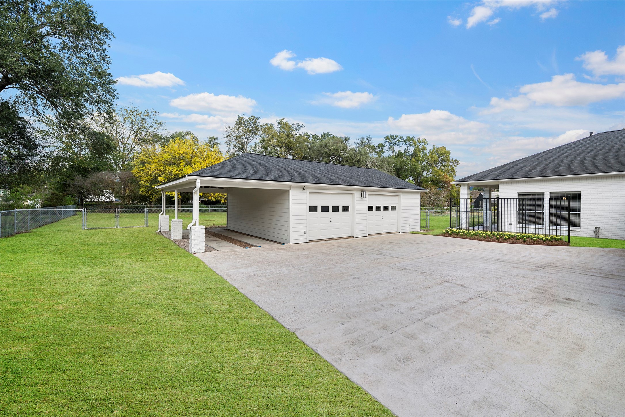 4419 Langtry Lane Houston, TX 77041 - Photo 33 of 50 a view of a house with a yard and a garage