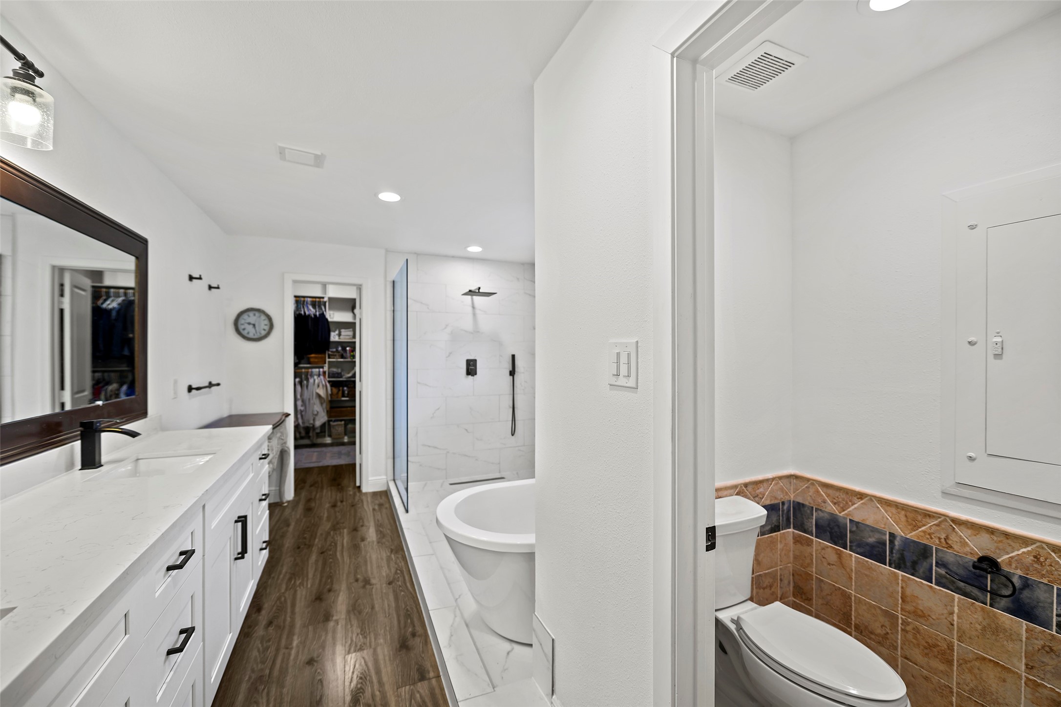 4419 Langtry Lane Houston, TX 77041 - Photo 5 of 50 a bathroom with a sink a toilet a mirror and shower