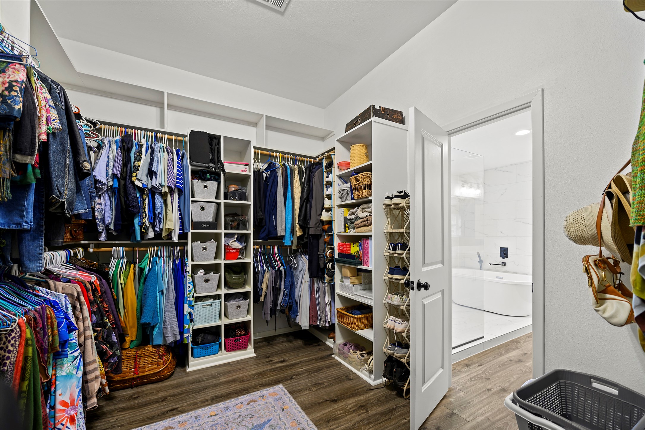 4419 Langtry Lane Houston, TX 77041 - Photo 7 of 50 a view of walk in closet with clothes and shoes