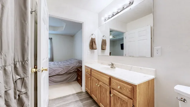 a spacious bathroom with a double vanity sink mirror and