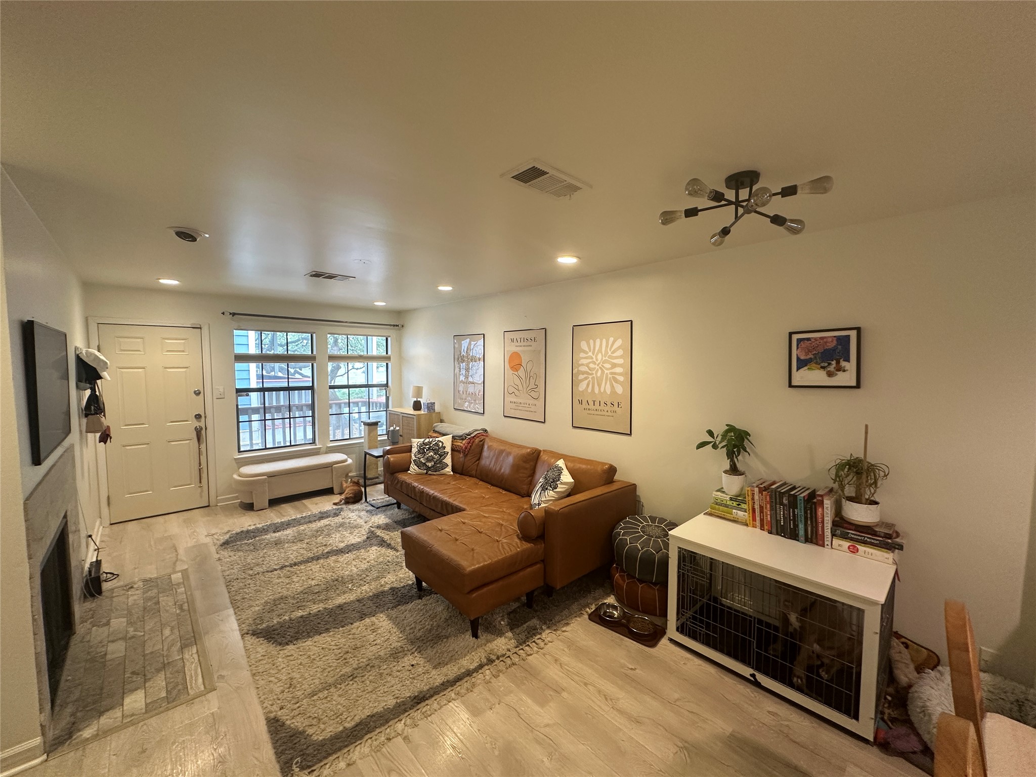 2215 Post Road, Unit 2002 Austin, TX 78704 - Photo 2 of 12 a living room with furniture and a flat screen tv