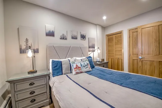 a bedroom with a bed and a dresser