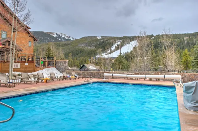 a view of a swimming pool and an outdoor seating