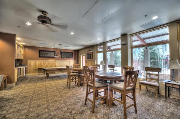 a view of a dining room with furniture window and outside view