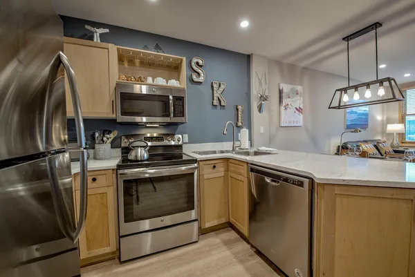 a kitchen with a stove and a microwave