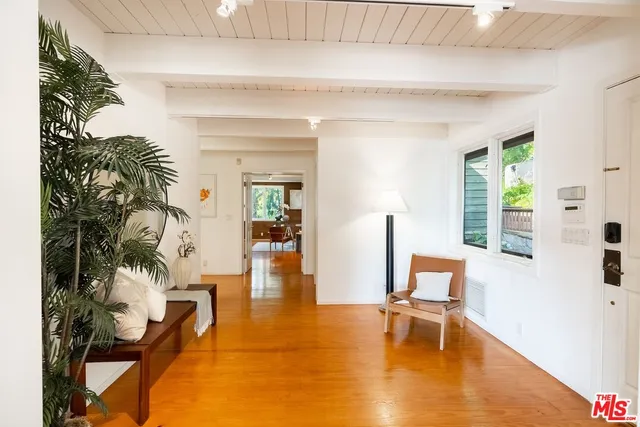 a living room with furniture and a table